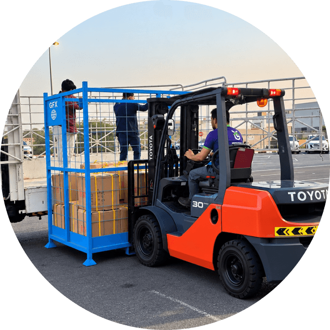 Forklift moving wrapped pallets inside a warehouse