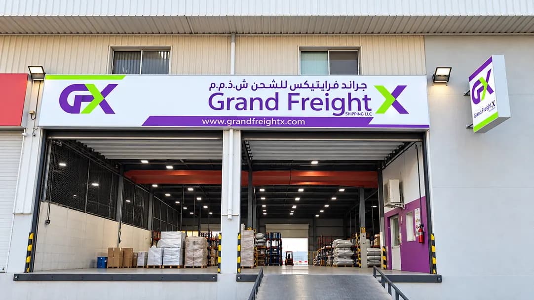 Grand FreightX warehouse frontage with branded signage and open loading bays